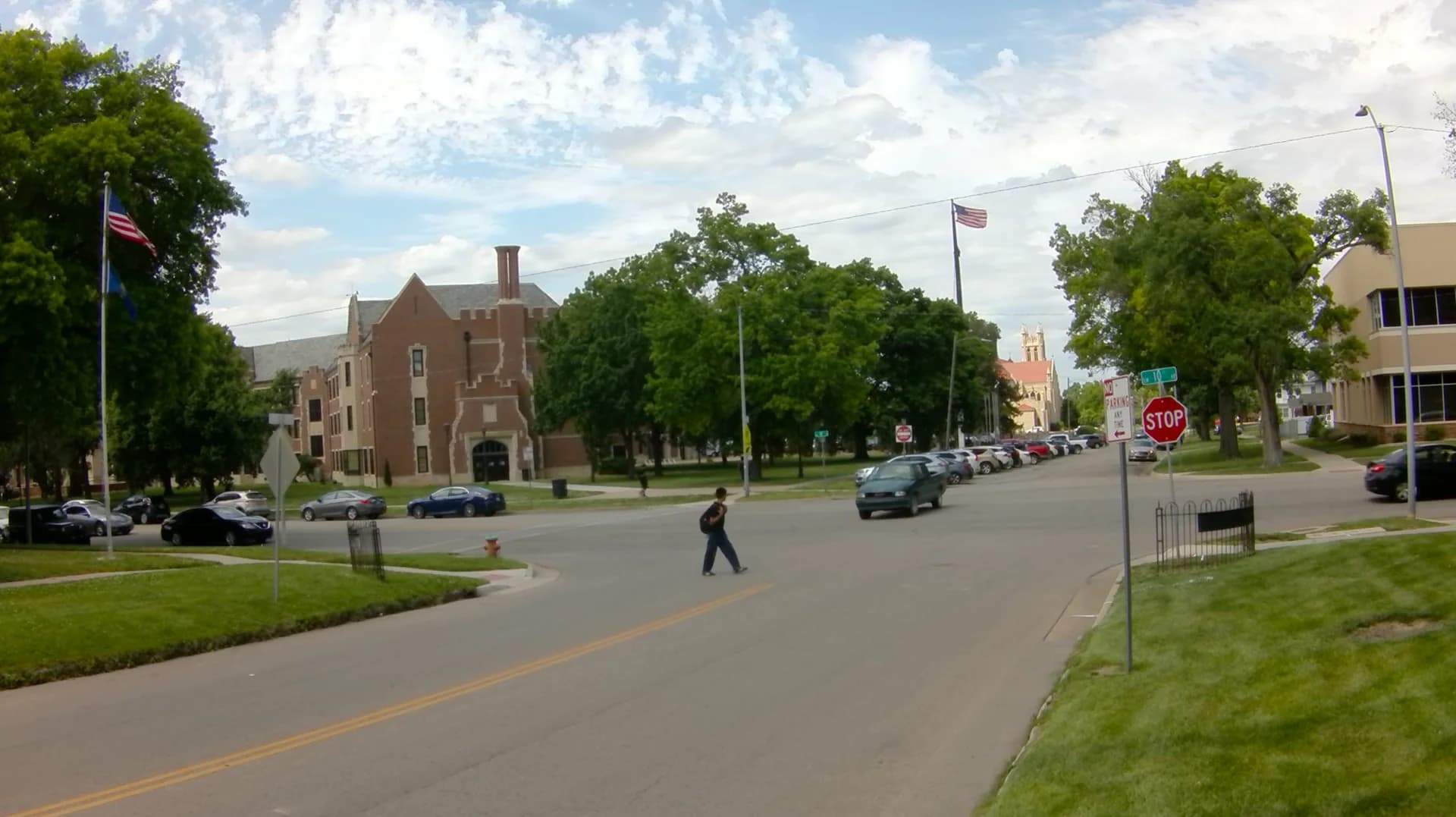 Pedestrian crossing the intersection with a vehicle approaching